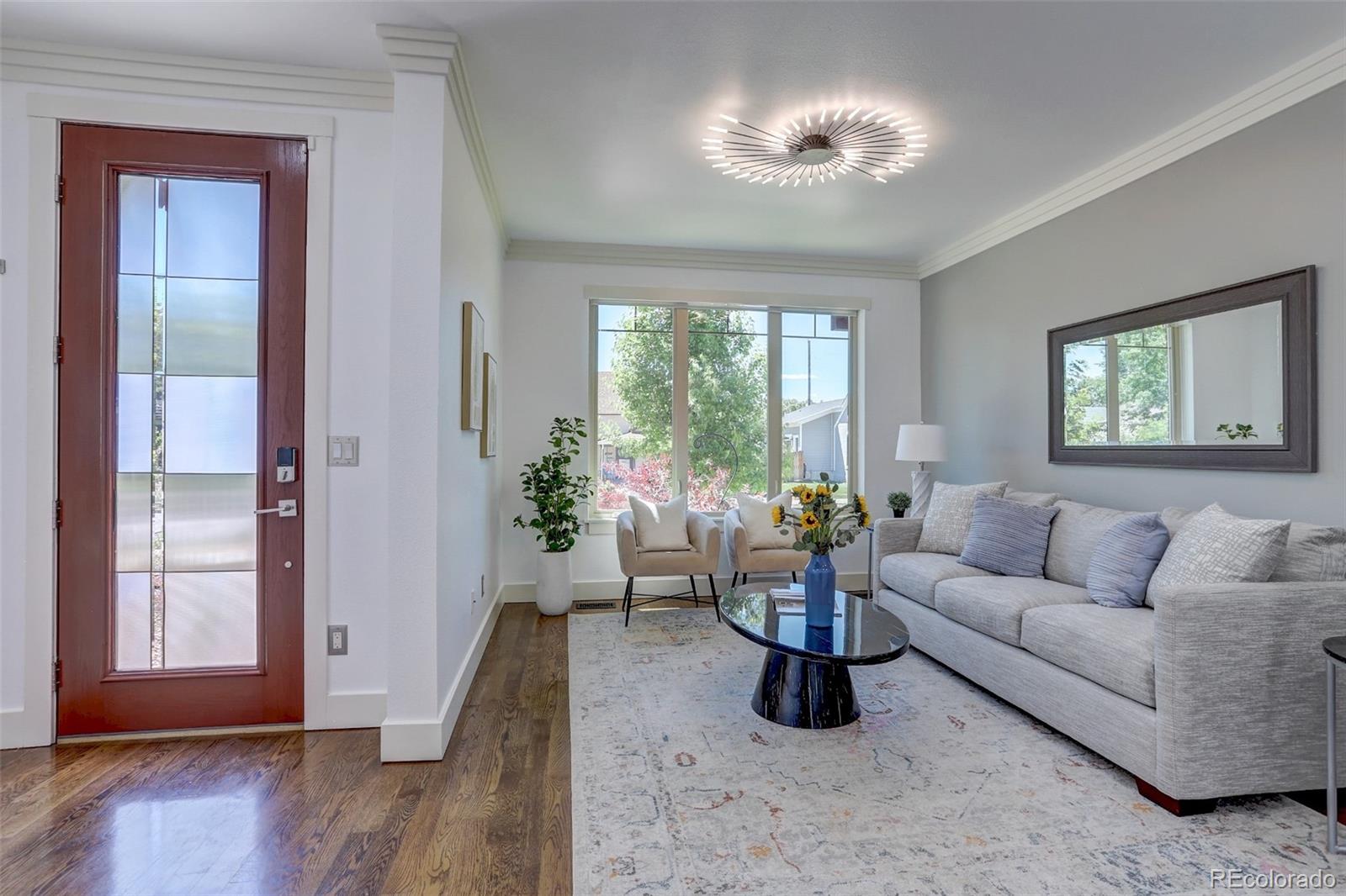 4238 Stuart Street Denver, CO 80212 - Photo 9 of 50 a living room with furniture and a large window