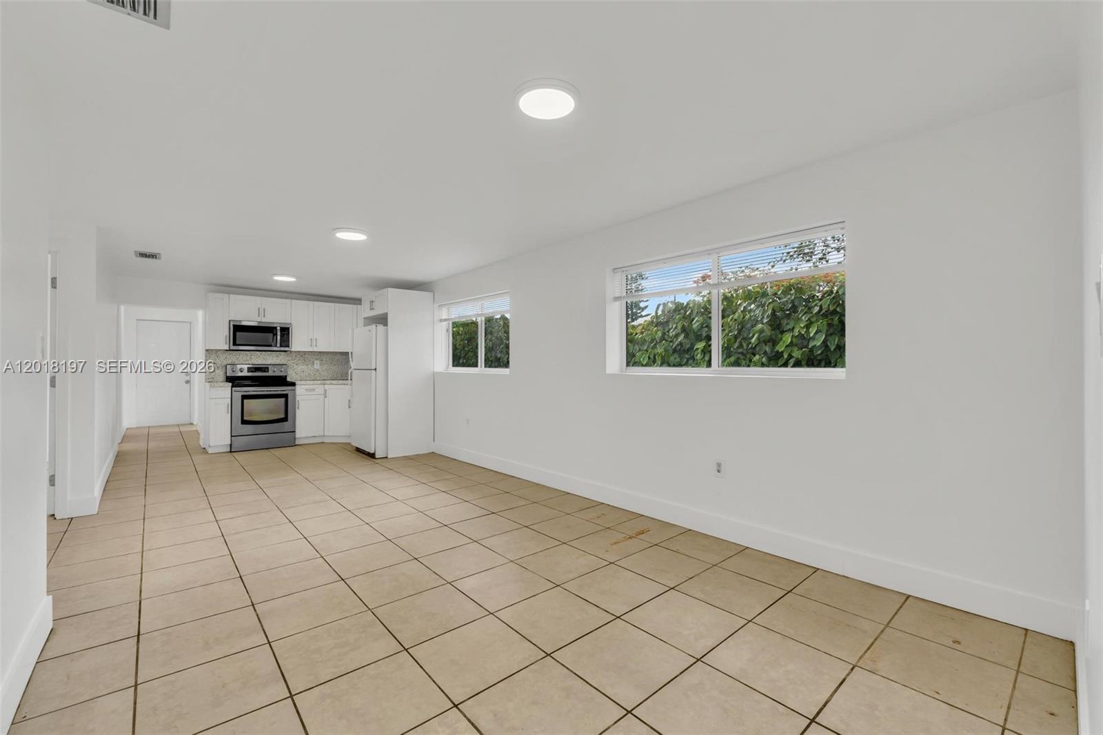 628 Southwest 8th Avenue Homestead, FL 33030 - Photo 6 of 25 a view of kitchen with furniture and window