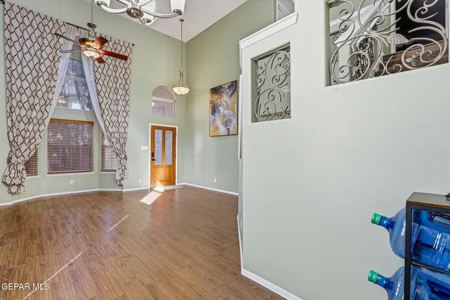 a kitchen with stainless steel appliances granite countertop wooden cabinets a sink and a window