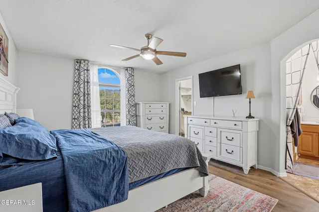 a bathroom with a sink a mirror a vanity and a window