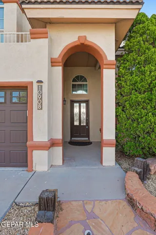 a view of a livingroom with wooden floor and a fireplace