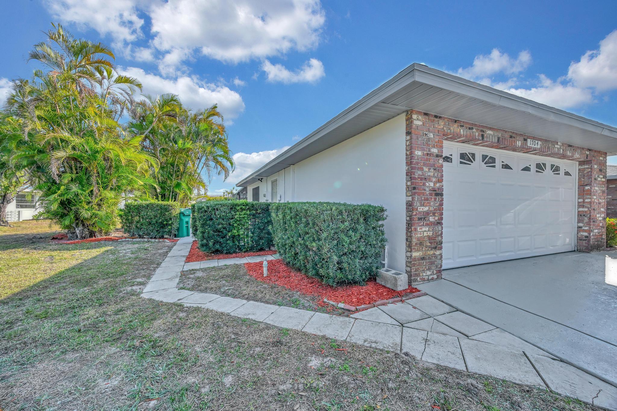 1704 Southeast Adair Road Port St. Lucie, FL 34952 - Photo 6 of 54 Side