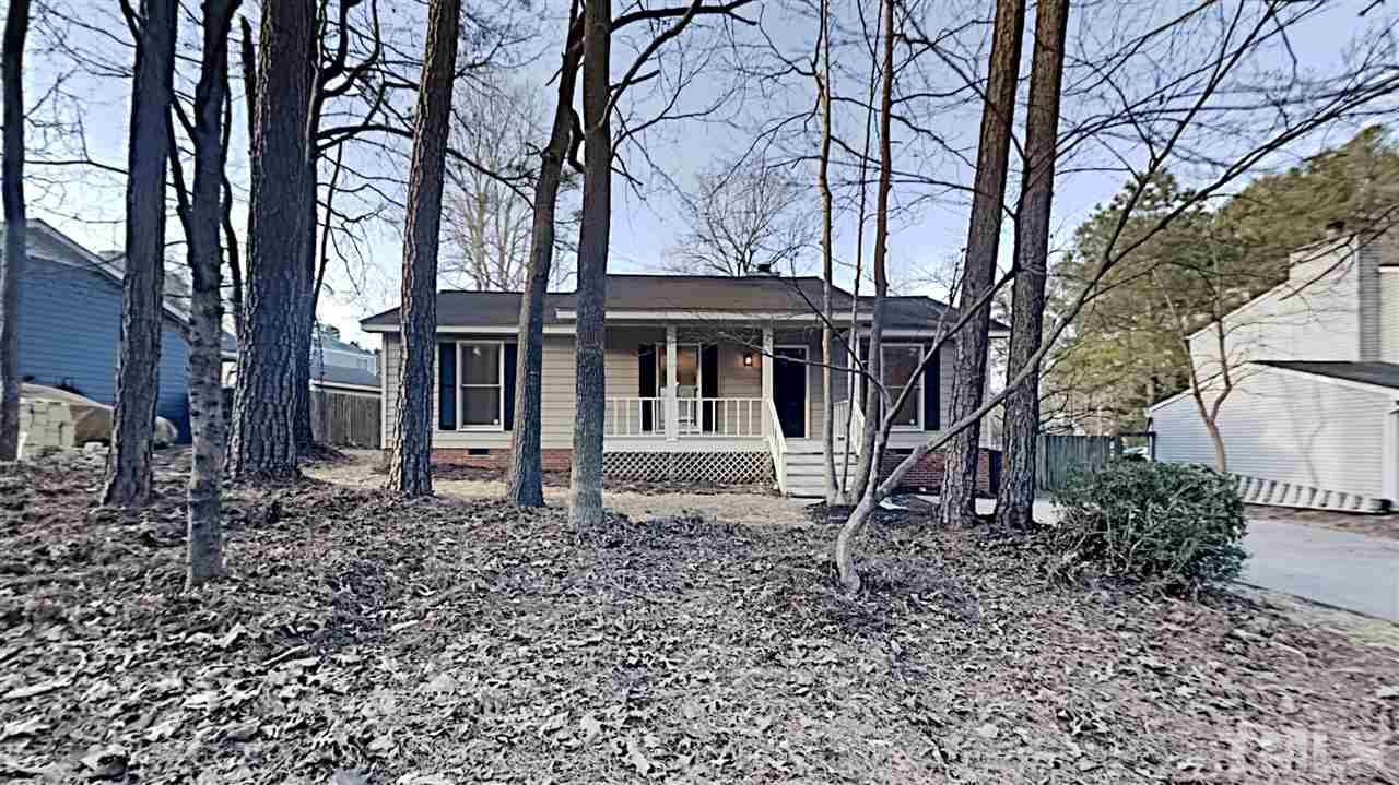 4225 Labrador Drive Raleigh, NC 27616 - Photo 1 of 13 a house with trees in front of it
