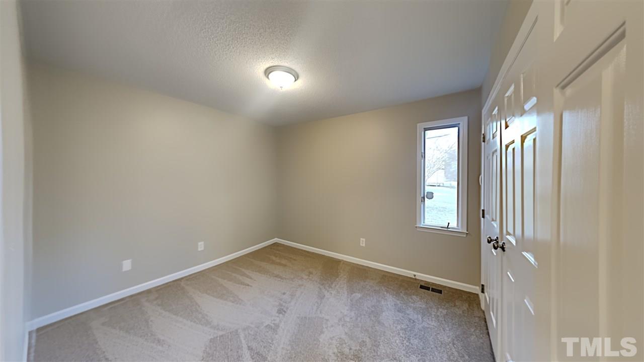 4225 Labrador Drive Raleigh, NC 27616 - Photo 11 of 13 an empty room with windows