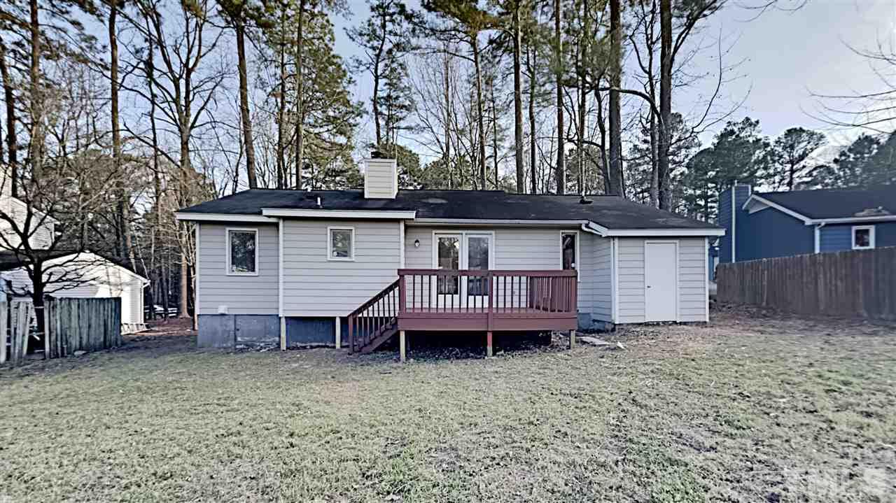 4225 Labrador Drive Raleigh, NC 27616 - Photo 13 of 13 a view of a house that has a small deck and a wooden bench