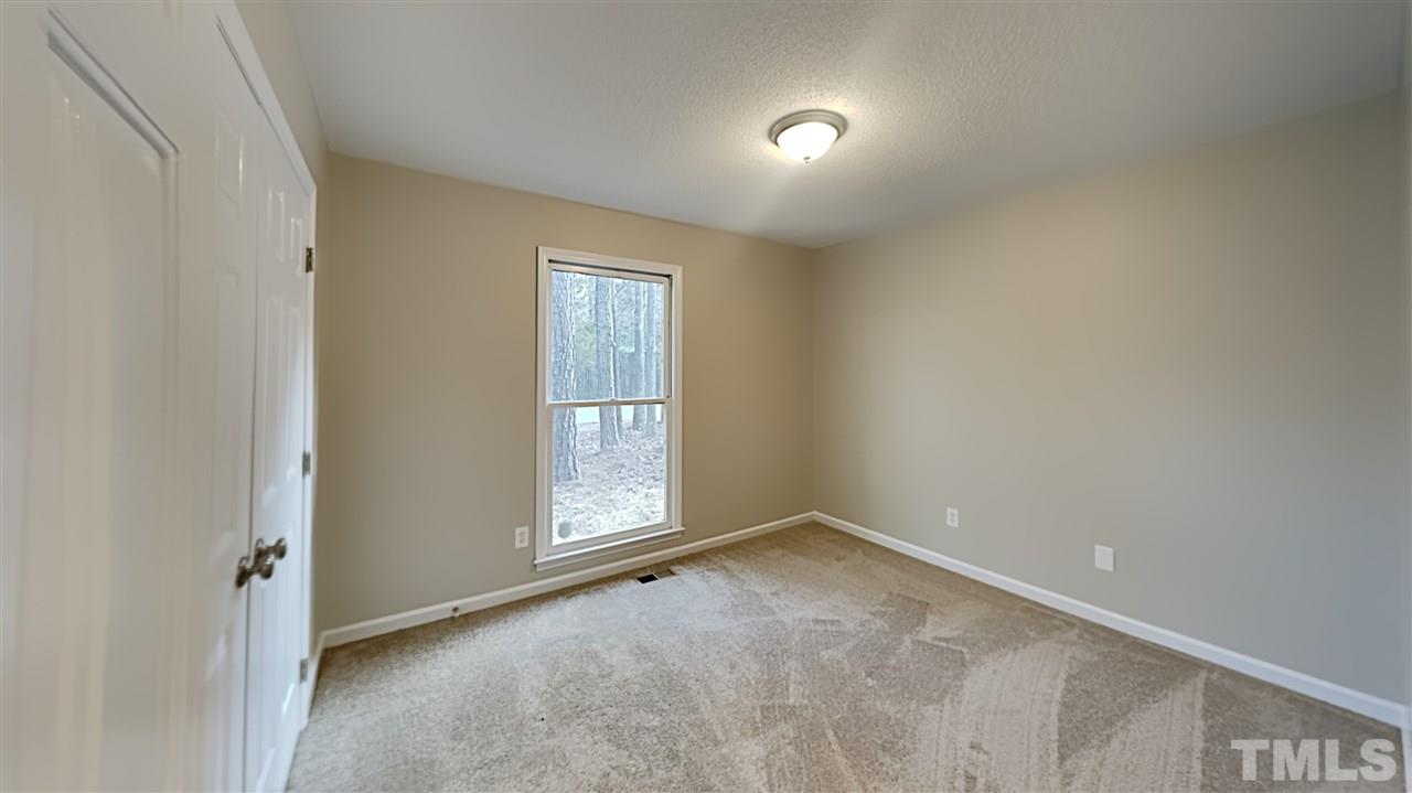 4225 Labrador Drive Raleigh, NC 27616 - Photo 10 of 13 an empty room with windows