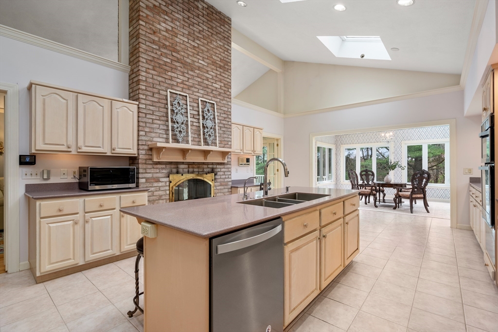 67 Bridle Path Sudbury, MA 01776 - Photo 13 of 42 a kitchen with a sink stove and cabinets