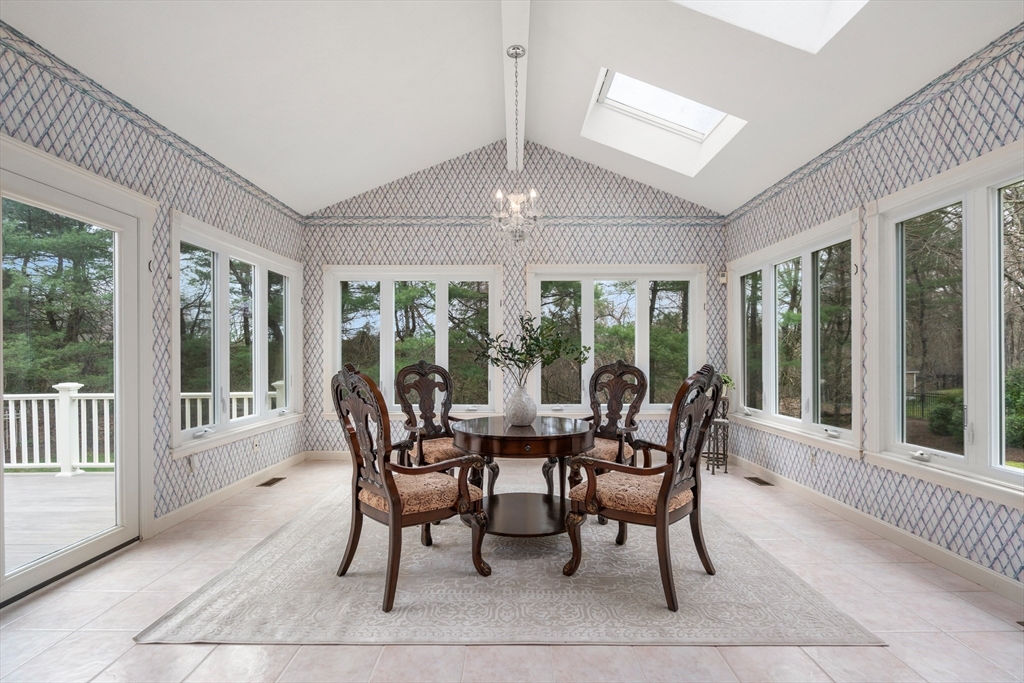 67 Bridle Path Sudbury, MA 01776 - Photo 18 of 42 a dining room with furniture a chandelier and wooden floor