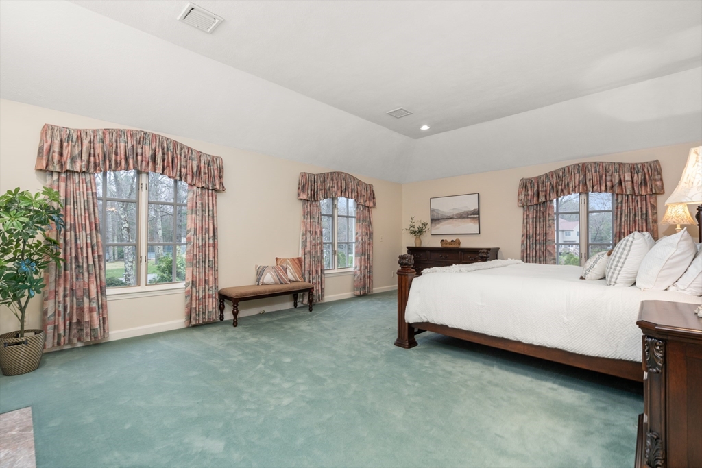 67 Bridle Path Sudbury, MA 01776 - Photo 21 of 42 a bedroom with a bed couch and a large window