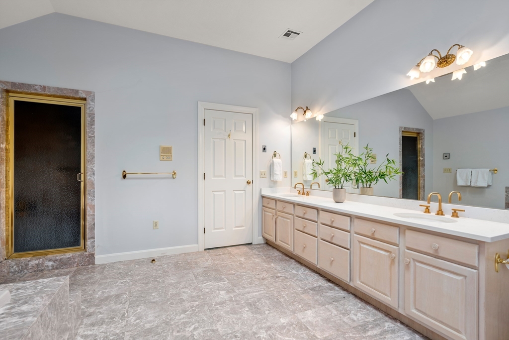 67 Bridle Path Sudbury, MA 01776 - Photo 22 of 42 a bathroom with a sink vanity and a mirror