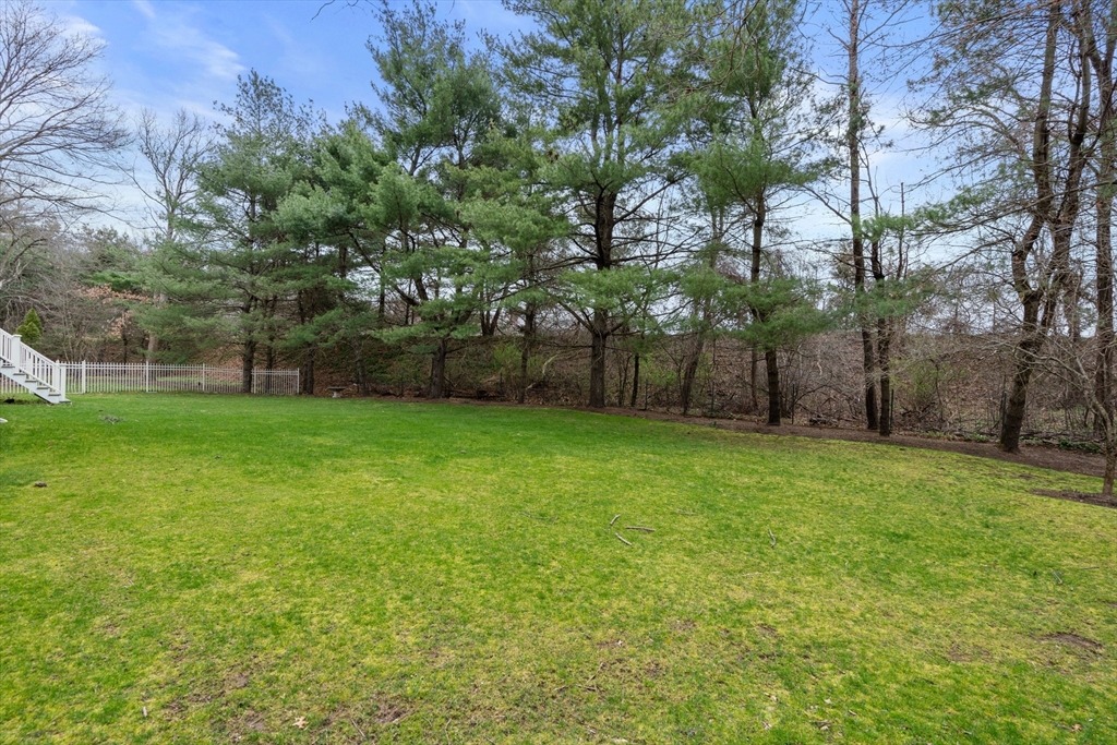 67 Bridle Path Sudbury, MA 01776 - Photo 33 of 42 a view of a backyard with a garden