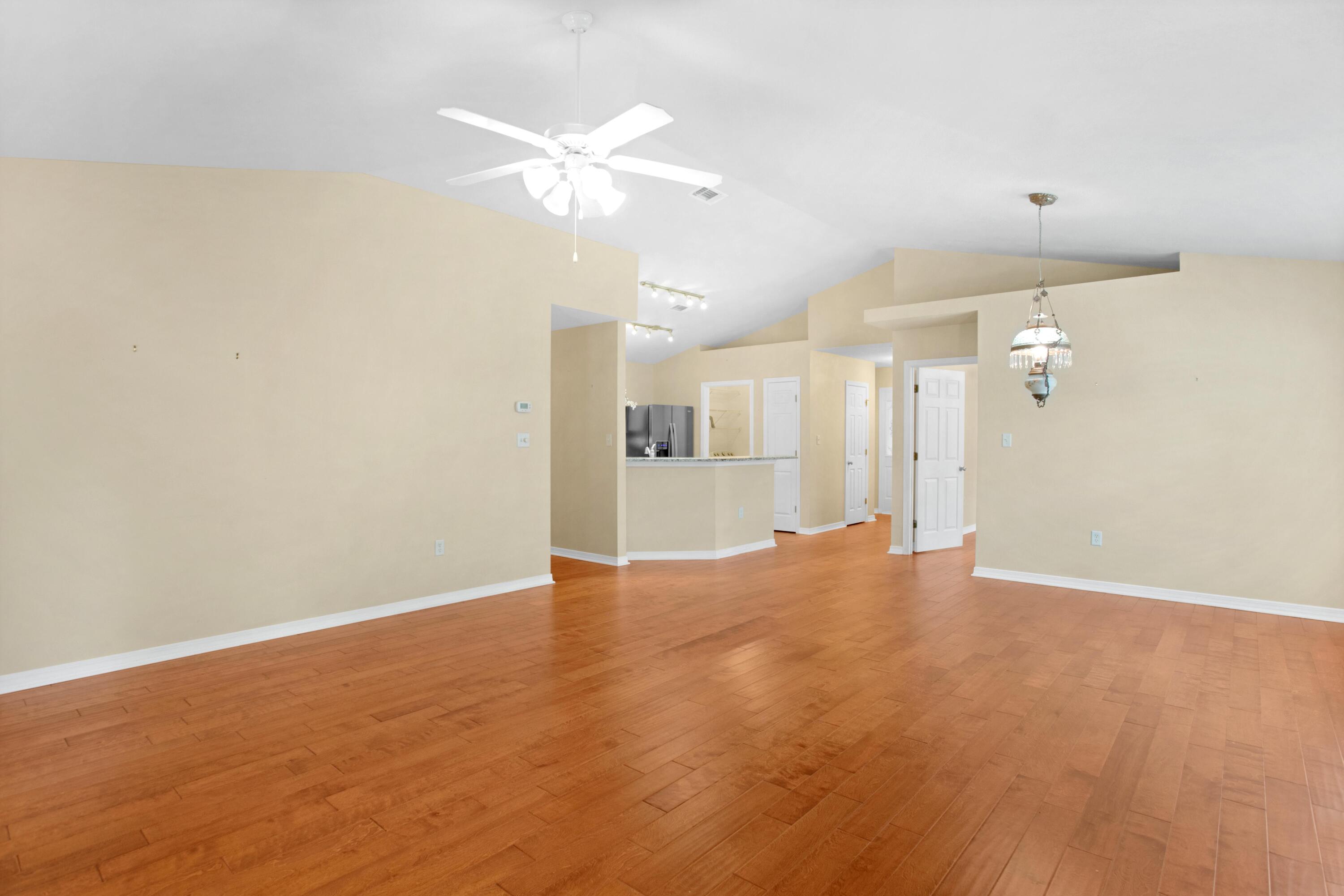 145 Bayou Landing Road Miramar Beach, FL 32550 - Photo 13 of 28 an empty room with wooden floor and bathroom view