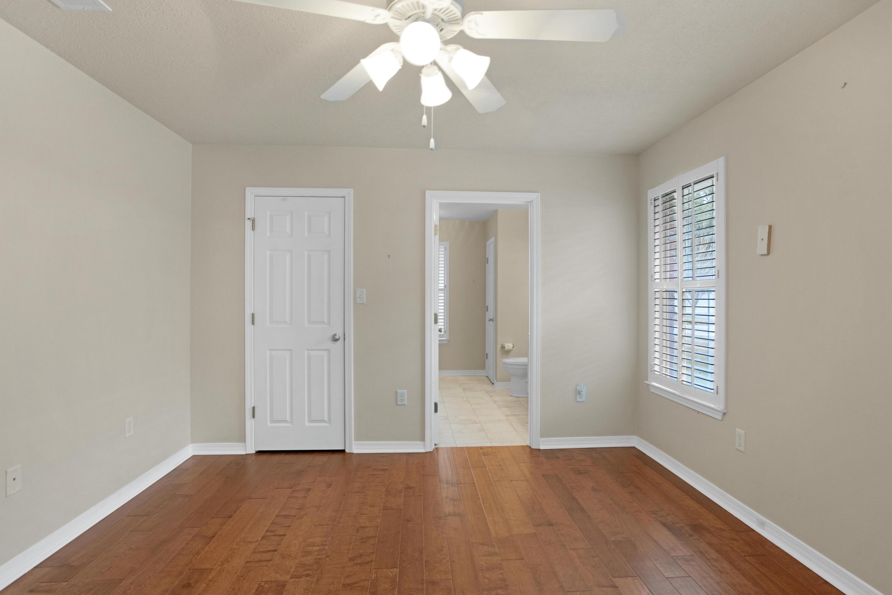 145 Bayou Landing Road Miramar Beach, FL 32550 - Photo 14 of 28 wooden floor in an empty room with a window