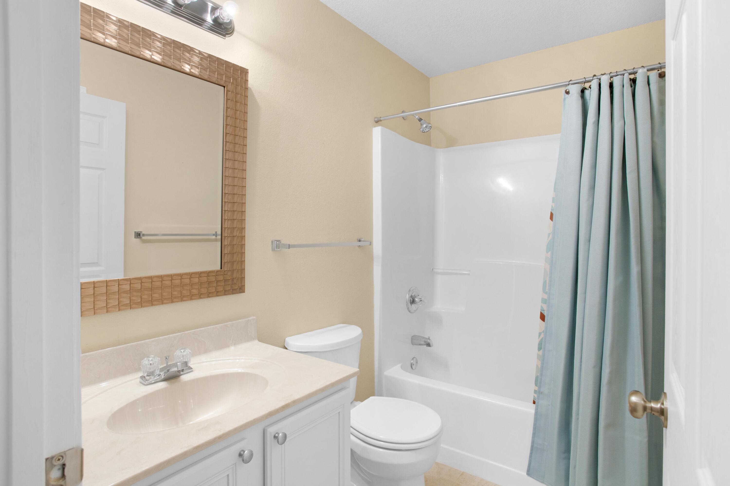 145 Bayou Landing Road Miramar Beach, FL 32550 - Photo 23 of 28 a bathroom with a sink a toilet and shower