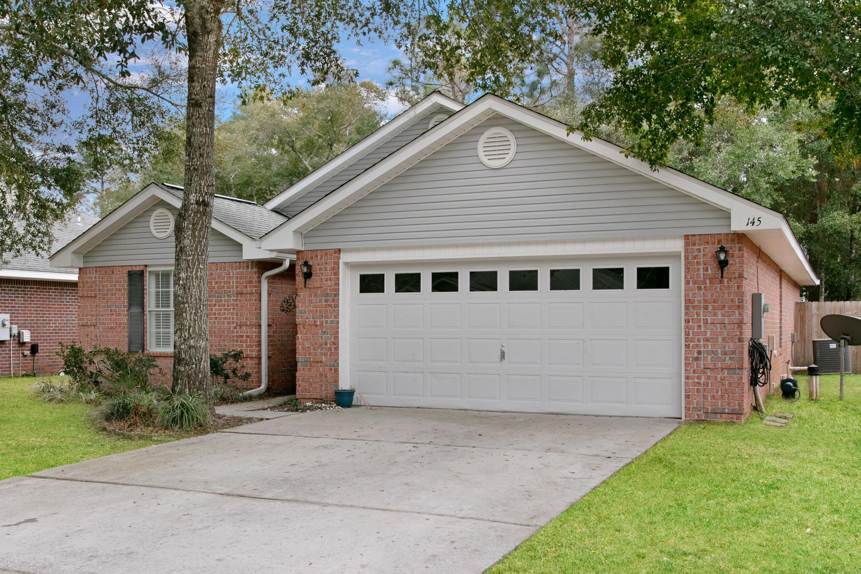145 Bayou Landing Road Miramar Beach, FL 32550 - Photo 3 of 28 a view of a house with a yard