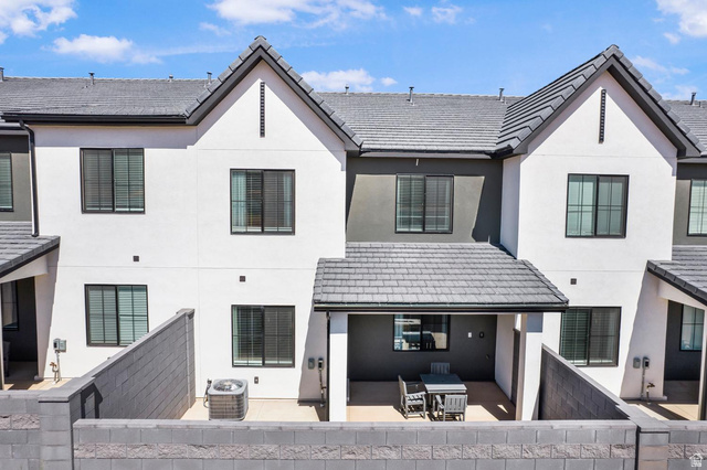 1705 Ripple Rock Drive, Unit 3017 Washington, UT 84780 - Photo 18 of 22 Contemporary townhome exterior with a covered patio