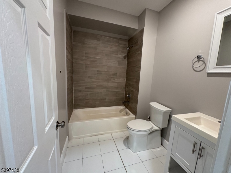 274 Governor Street Paterson, NJ 07501 - Photo 14 of 14 a bathroom with a toilet and a shower