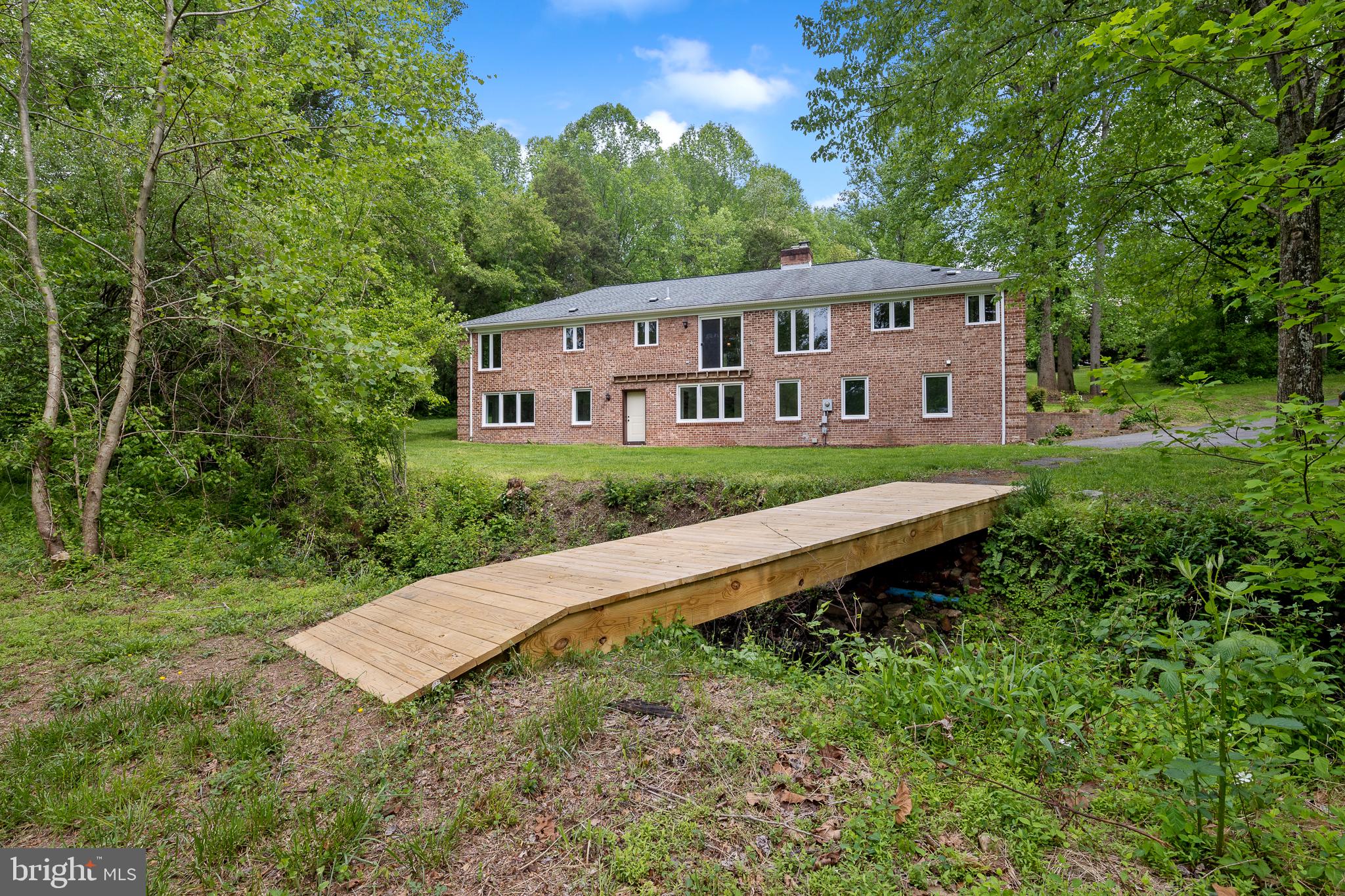 7432 Clifton Road Clifton, VA 20124 - Photo 4 of 6 Back View w/Bridge over Stream