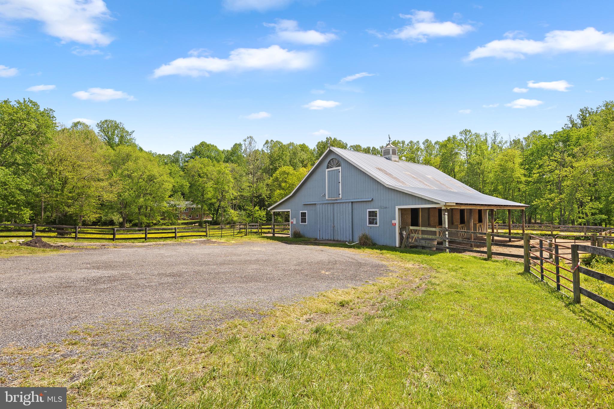 7432 Clifton Road Clifton, VA 20124 - Photo 5 of 6 Center Aisle Barn with Home in the Distance