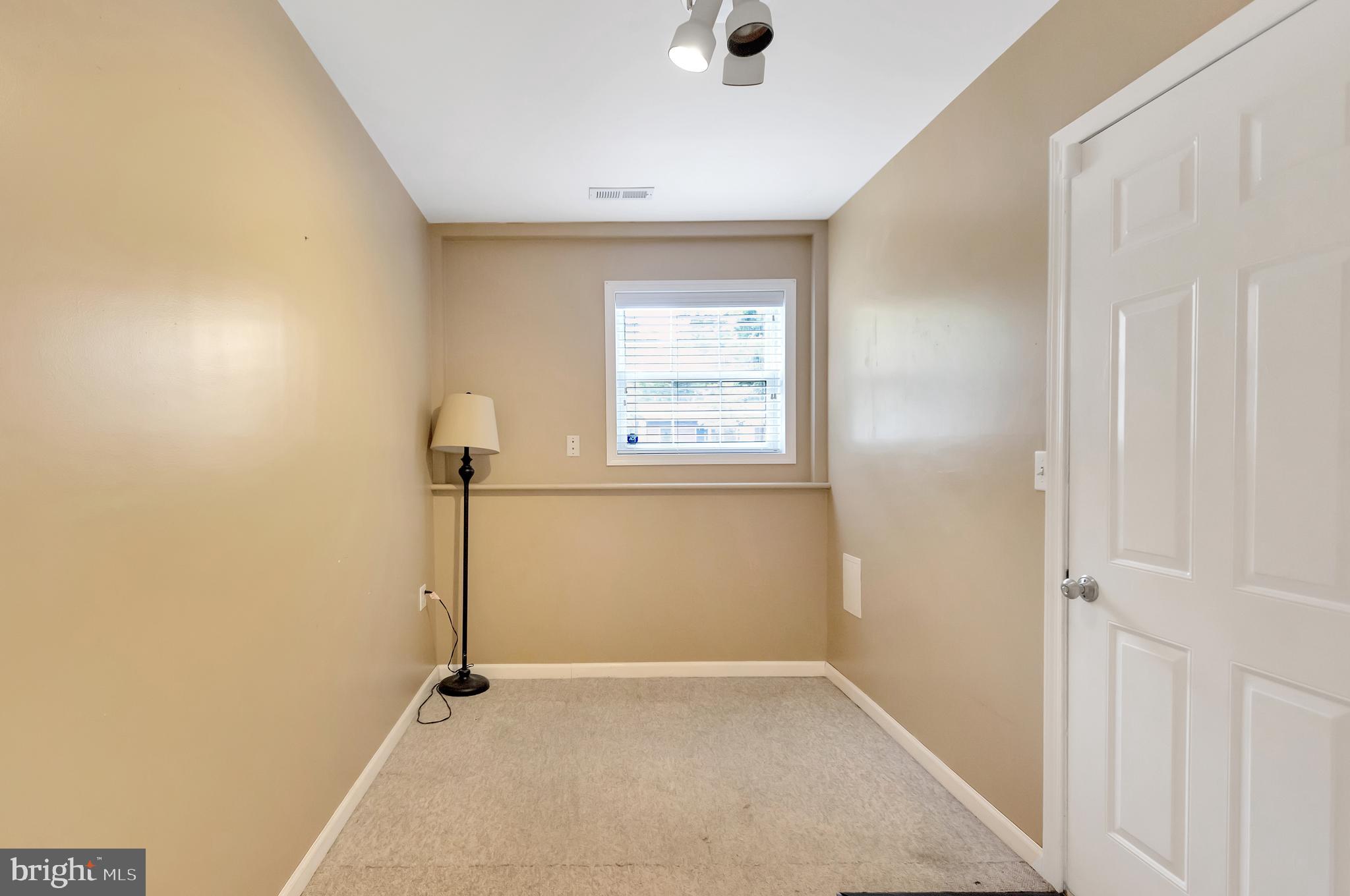 912 Crystal Rock Road Lusby, MD 20657 - Photo 23 of 27 Basement nook leading to garage