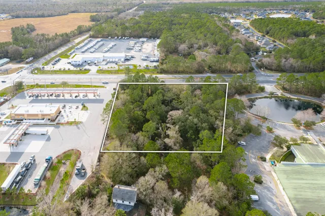 an aerial view of a residential houses with outdoor space