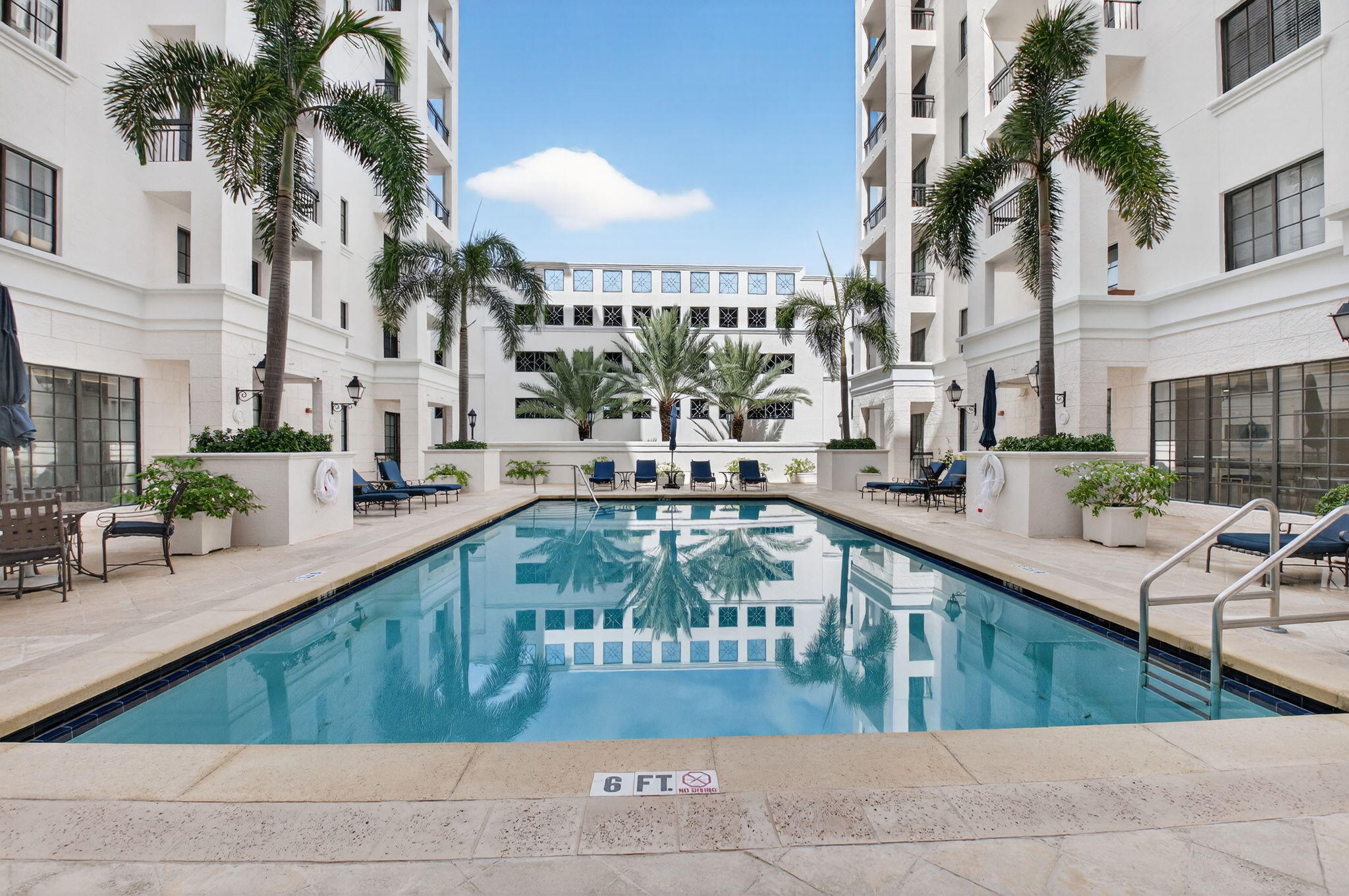 233 South Federal Highway, Unit 321 Boca Raton, FL 33432 - Photo 12 of 40 a view of a swimming pool with outdoor seating