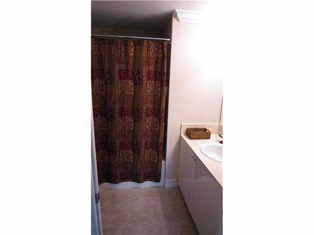 233 South Federal Highway, Unit 321 Boca Raton, FL 33432 - Photo 9 of 40 a hallway with a door and a microwave