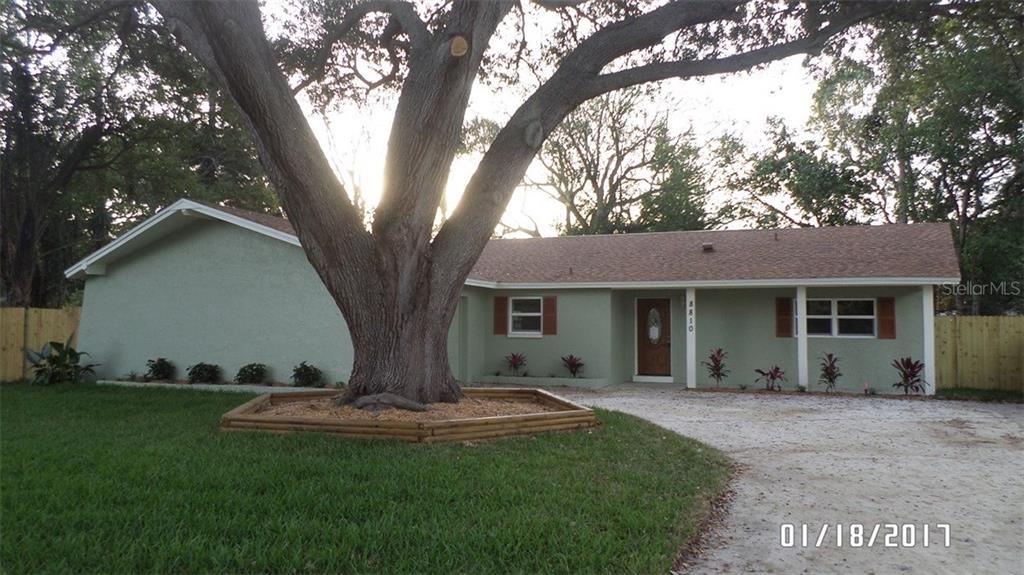 8810 118th Way Seminole, FL 33772 - Photo 1 of 1 a view of a house with backyard and garden