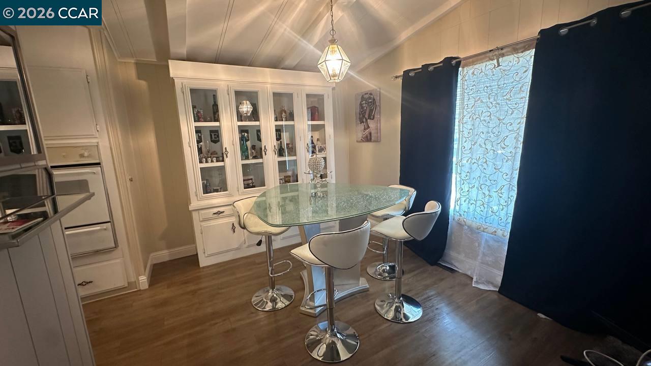 367 Ravine Circle Rancho Cordova, CA 95670 - Photo 7 of 21 a dining room with wooden floor and a table