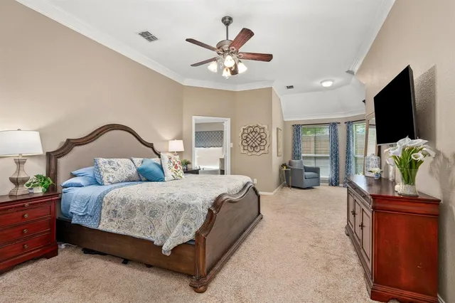 a kitchen that has a lot of cabinets in it and wooden floors