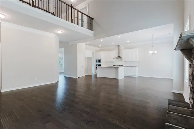 a view of kitchen with refrigerator and window