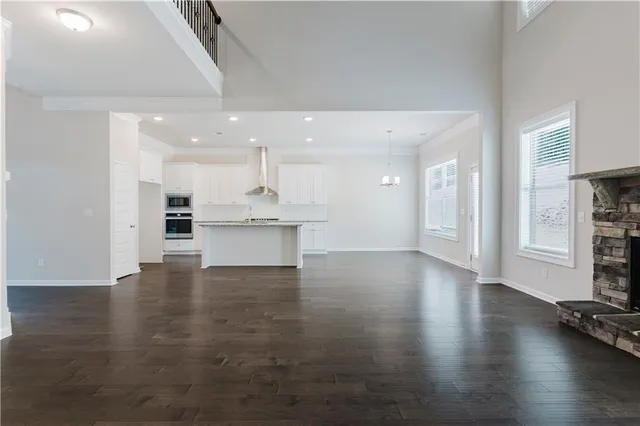 a view of kitchen with furniture and wooden floor