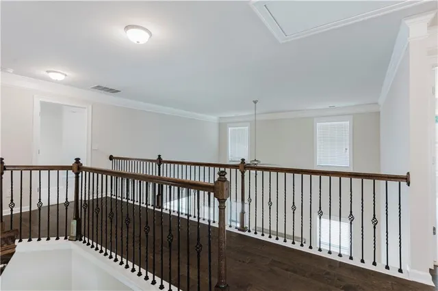 a view of hallway with wooden floor