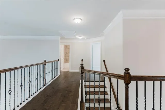 a view of staircase with rug