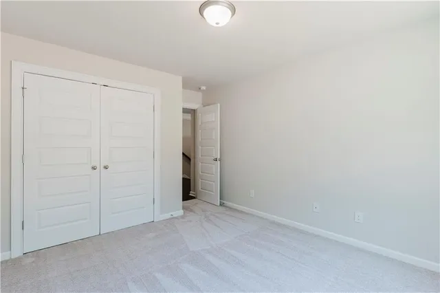 an empty room with closet area