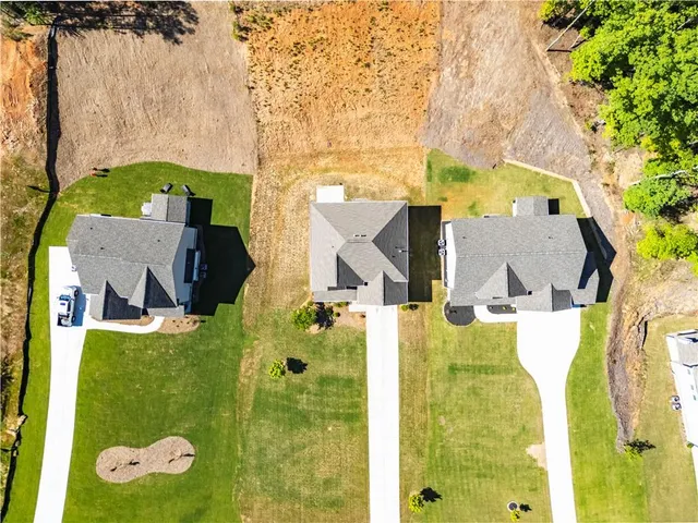 aerial view of a house with a yard
