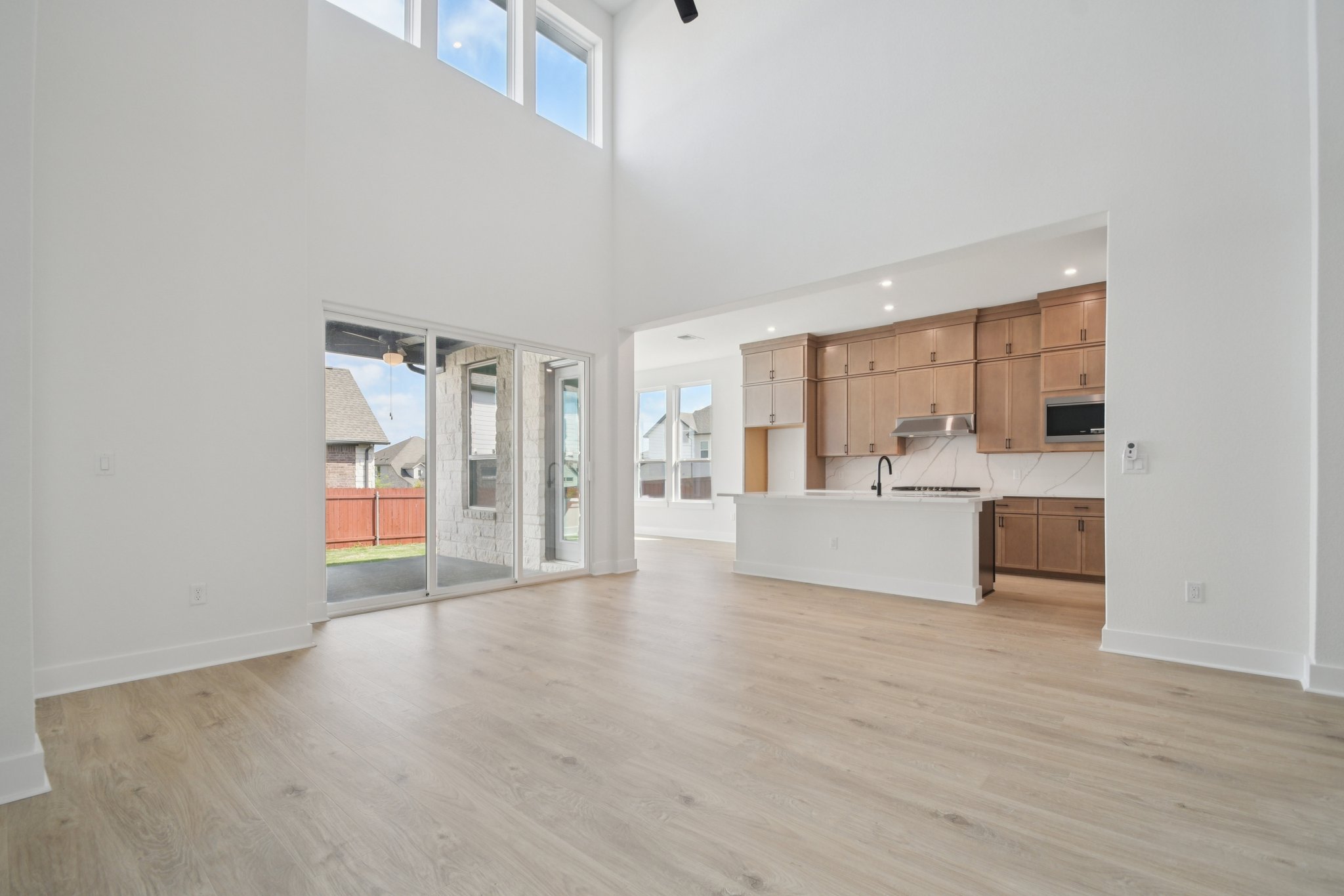 1660 Cardinal Lane Round Rock, TX 78681 - Photo 6 of 35 a view of a kitchen with wooden floor and a sink
