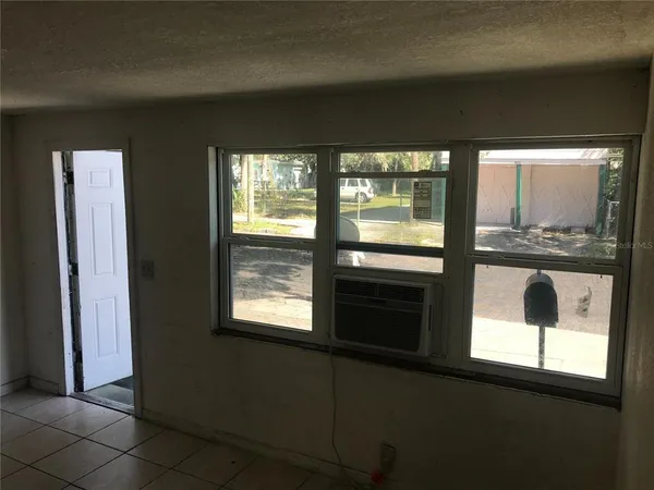 an empty room with a fireplace