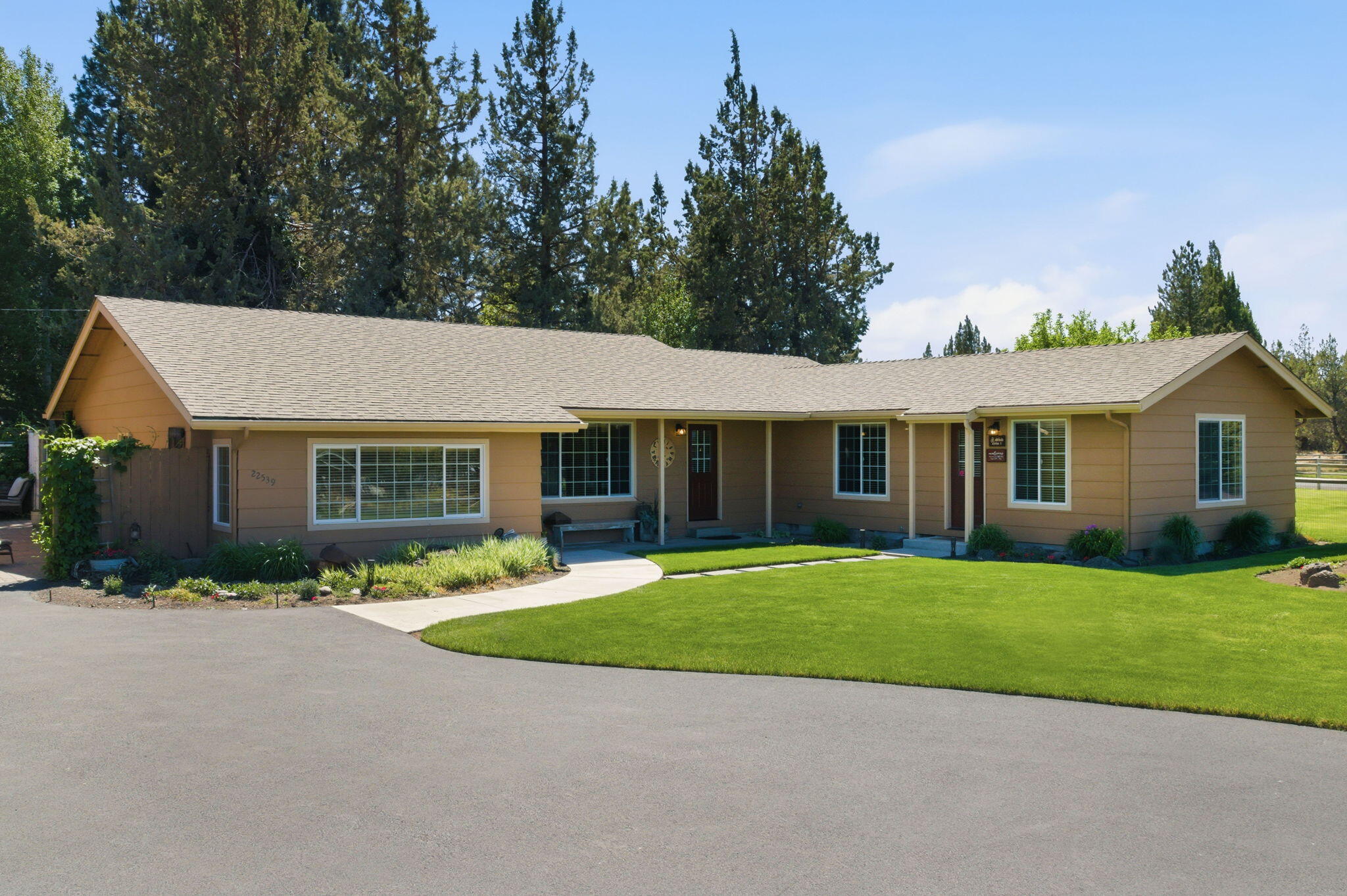 22539 Martee Lane Bend, OR 97701 - Photo 3 of 54 a front view of house with yard outdoor seating and green space