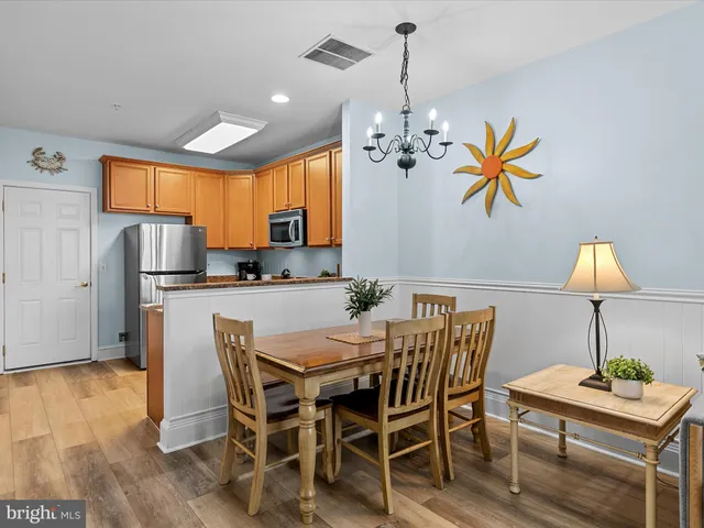 a living room with furniture dining table and a window