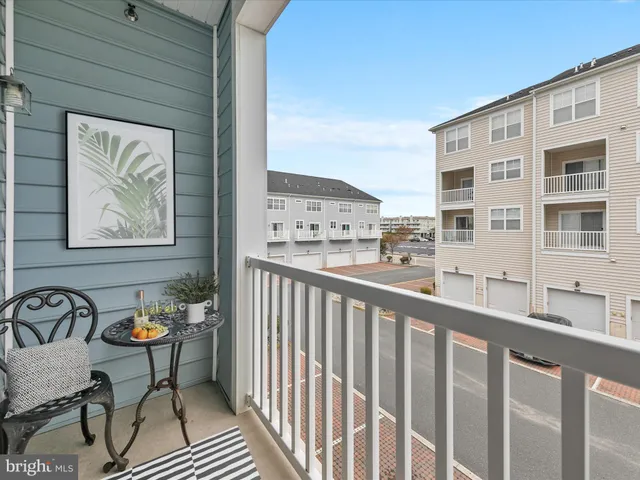 a bedroom with two beds and wooden floor