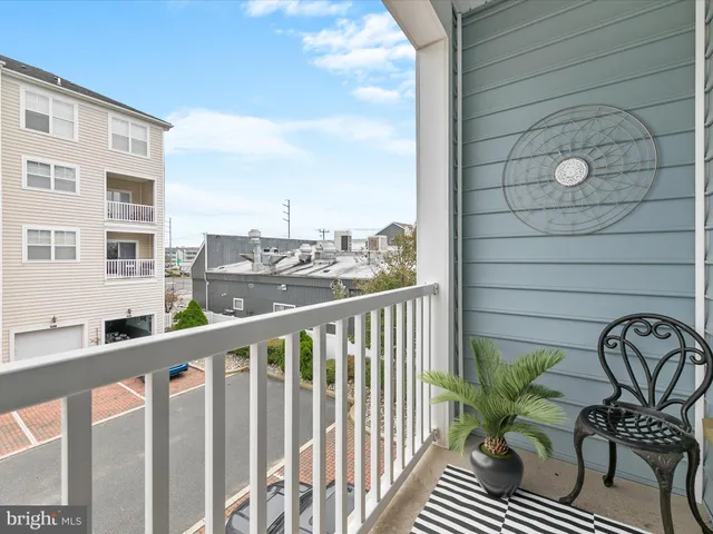 a view of a balcony and chairs