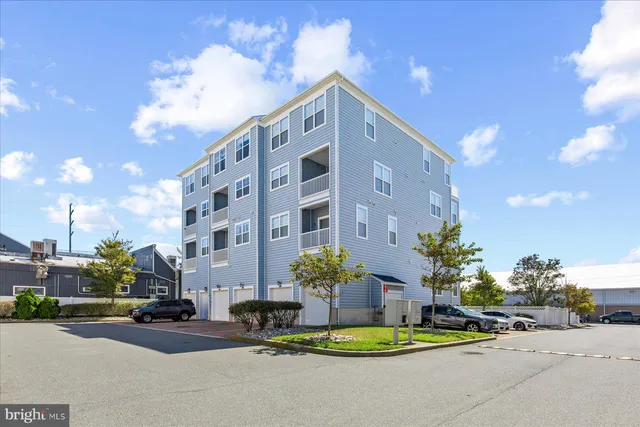 a car parked in front of a brick building