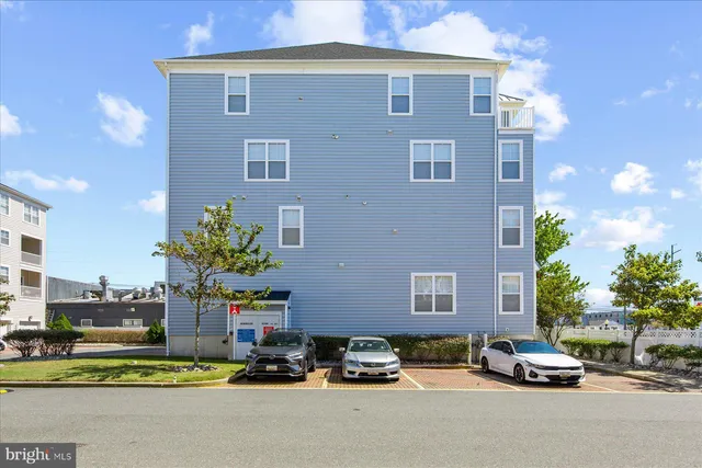 a front view of a house with a yard and a garage