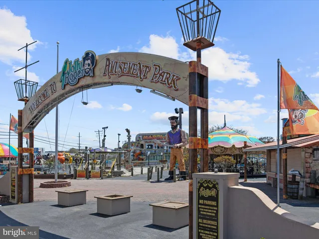 a roof deck with table and chairs