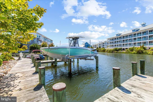 a balcony with table and chairs