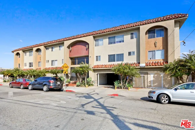 a view of a patio with table and chairs with wooden floor and fence