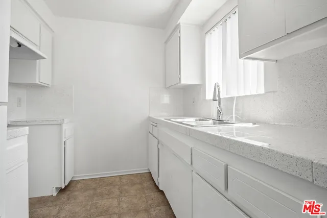 a bathroom with a sink double vanity and a mirror