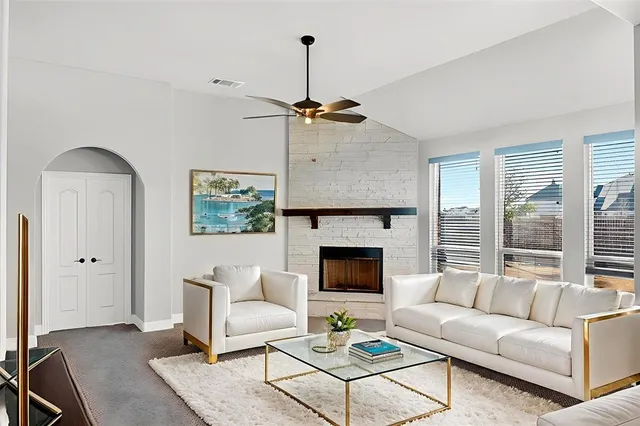 wooden floor in an empty room with a fireplace