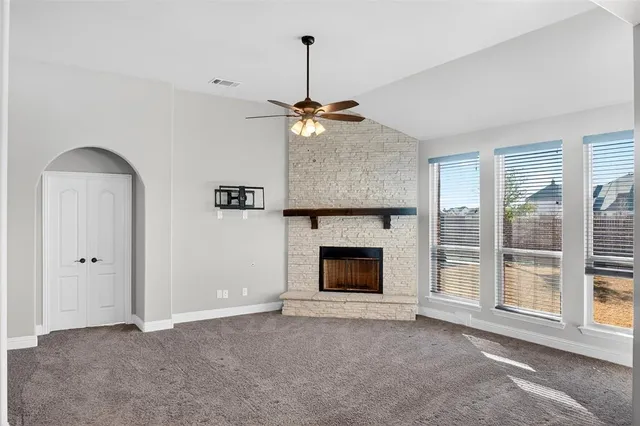 a bedroom with a large bed and a flat screen tv